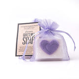 Small square white bar of goat milk soap with purple heart, packaged in lavender organza bag