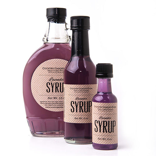 3 clear bottles of various sized bottles of lavender syrup