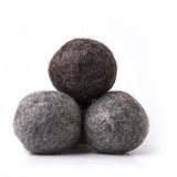 Pyramid of 3 brown and gray wool balls